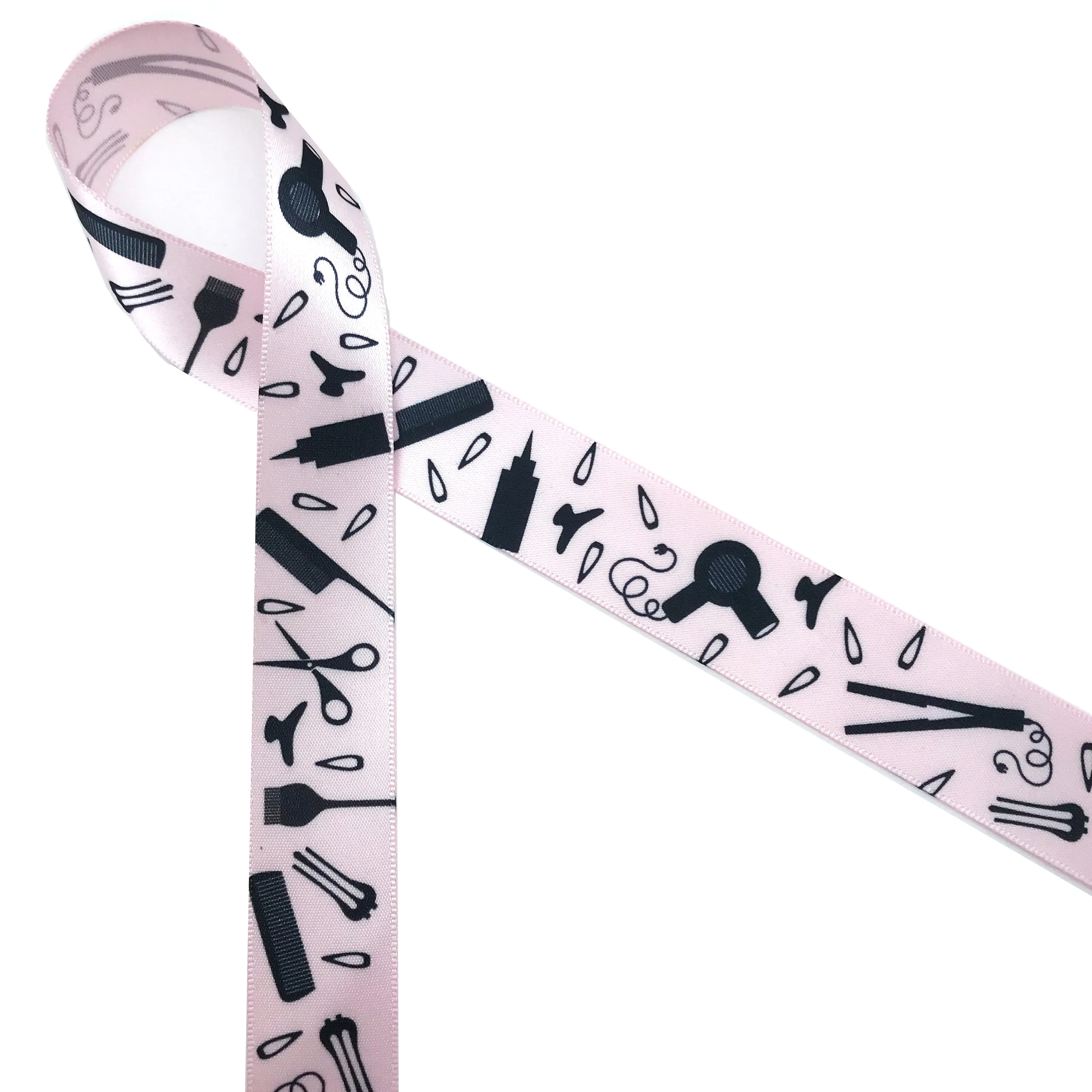 Hairdresser themed ribbon featuring hair pins, blow dryers, combs, brushes and more in black silhouette printed on 7/8" white single face satin