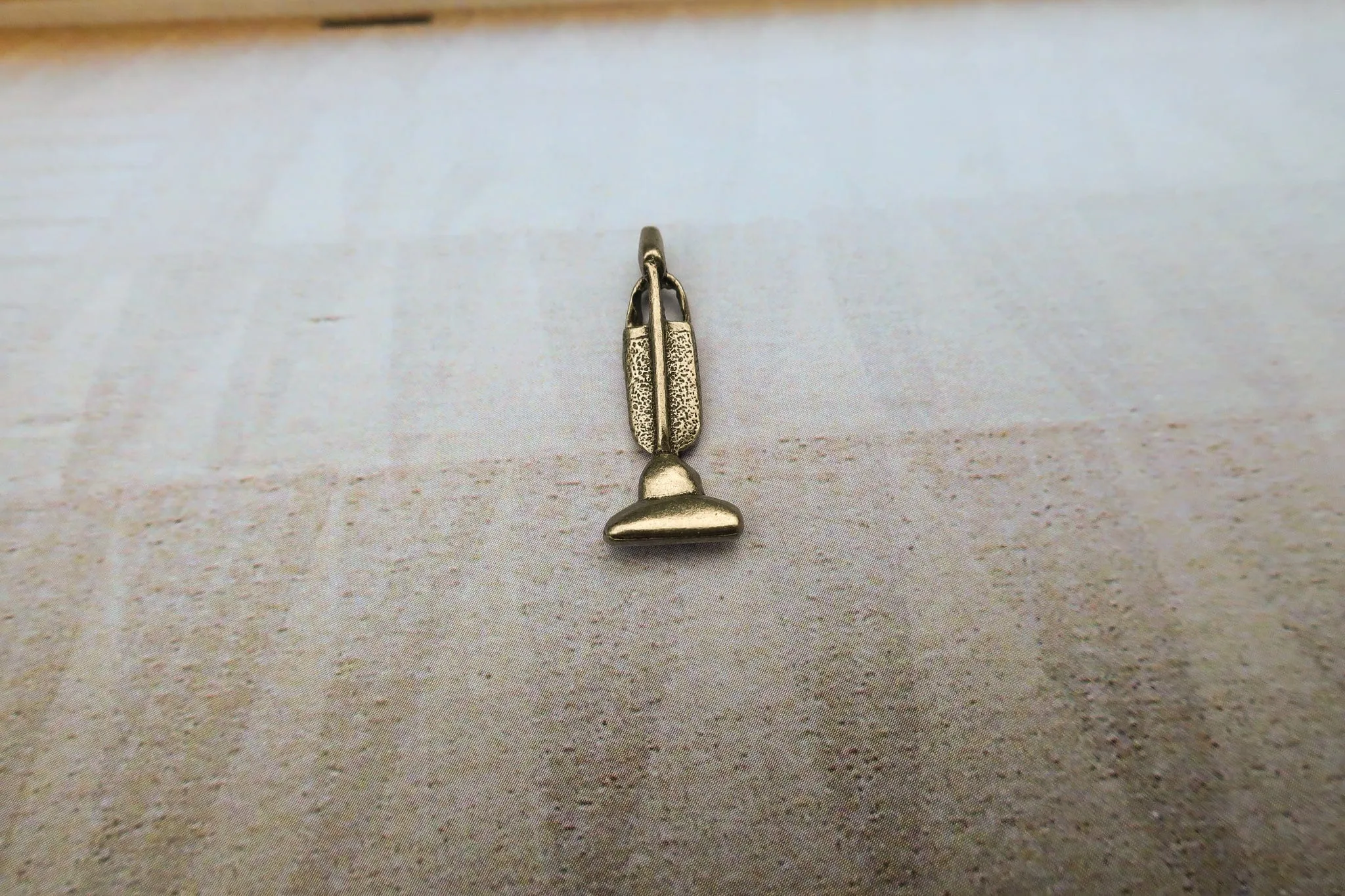 Vacuum Lapel Pin