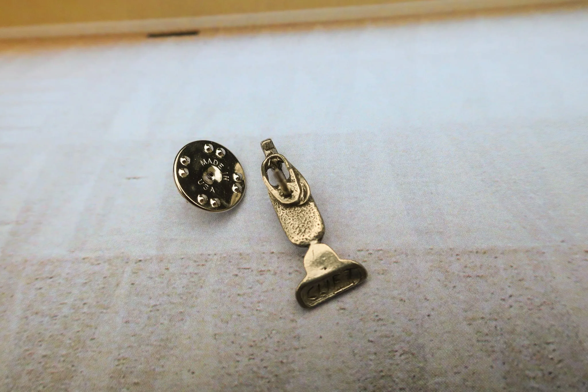 Vacuum Lapel Pin